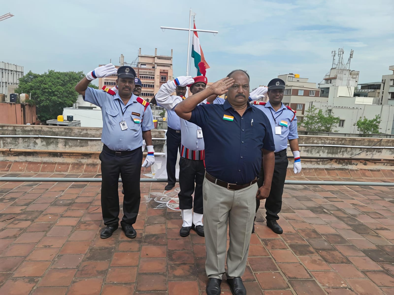 Monisha Security Agency team giving flag salute honour